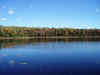 Clear skies, blue water, fall foilage